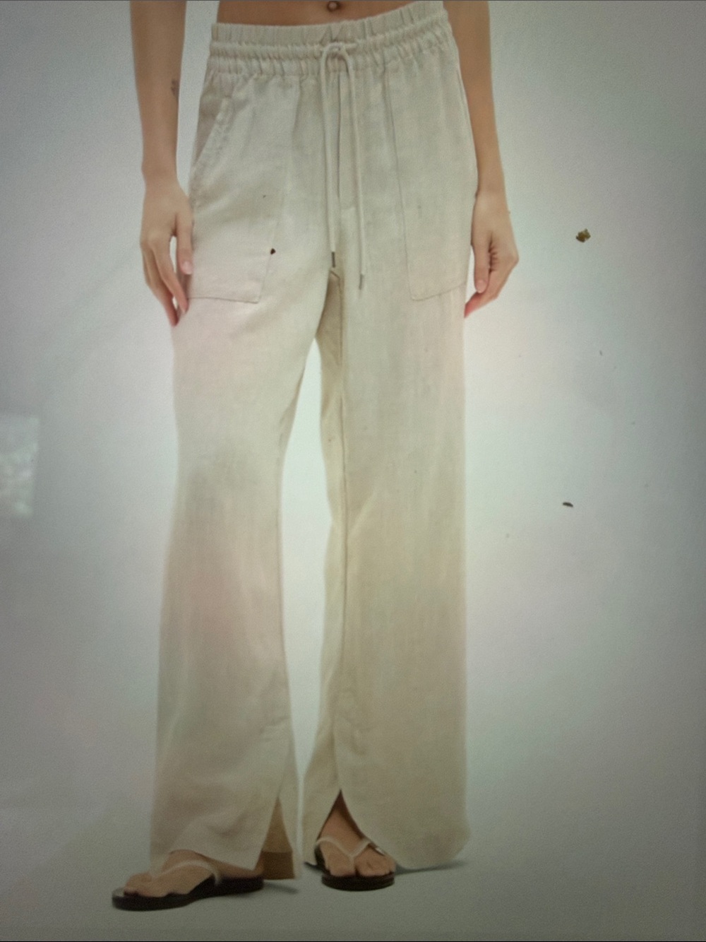 Athleta Retreat High Rise Wide-Leg Drawstring linenPants in undyed color. (Cream